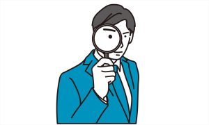 虫眼鏡をもったビジネスマン